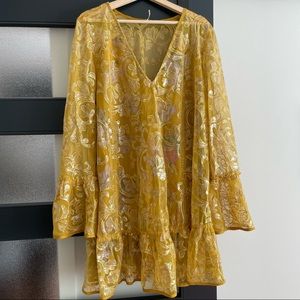 Anthropologie sequin yellow dress with bell sleeves.